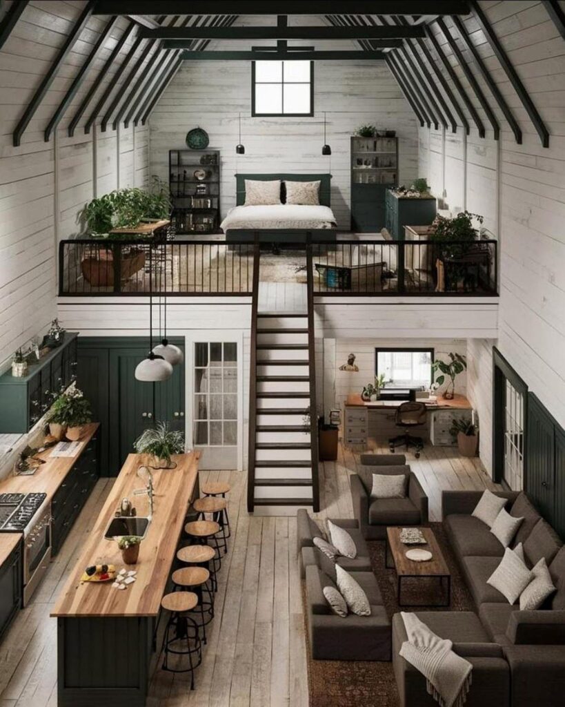 Small barn loft apartment with a downstairs living area and upstairs bedroom.